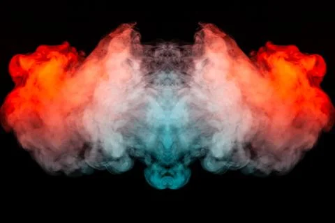 A bright dynamic pattern of explosive, fiery smoke illuminated in blue orange Foto stock