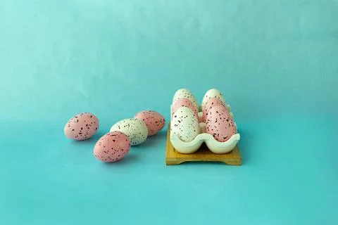 Bright easter eggs on a blue plain surface, easter decor Stock Photos