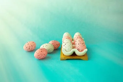 Bright easter eggs on a blue plain surface, easter decor Stock Photos