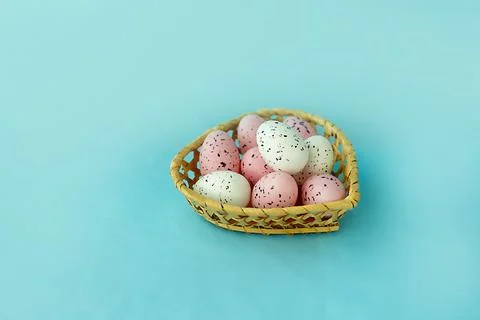 Bright easter eggs on a blue plain surface, easter decor Stock Photos