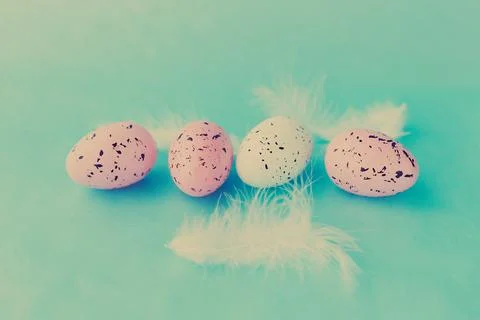 Bright easter eggs on a blue plain surface, easter decor Stock Photos
