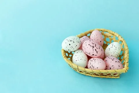 Bright easter eggs on a blue plain surface, easter decor Stock Photos