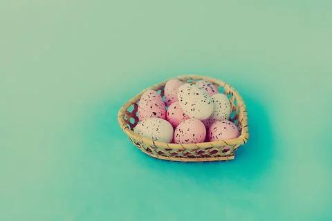 Bright easter eggs on a blue plain surface, easter decor Stock Photos