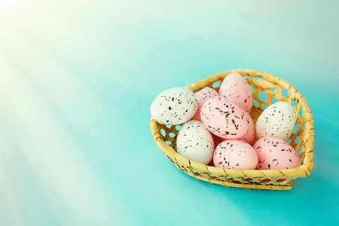 Bright easter eggs on a blue plain surface, easter decor Stock Photos