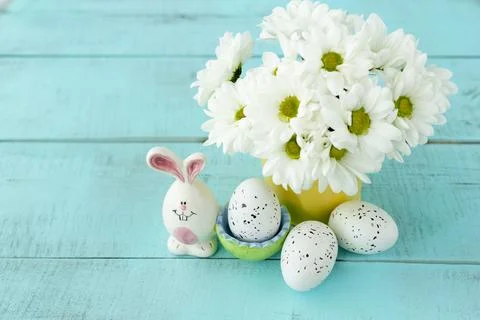 Bright easter eggs on a blue plain surface, easter decor Stock Photos