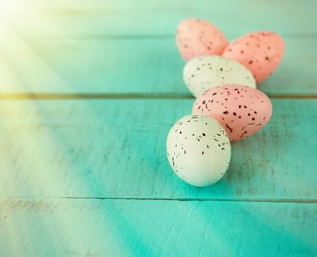 Bright easter eggs on a blue plain surface, easter decor Stock Photos