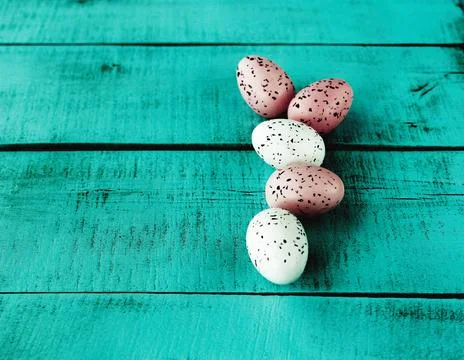 Bright easter eggs on a blue plain surface, easter decor Stock Photos
