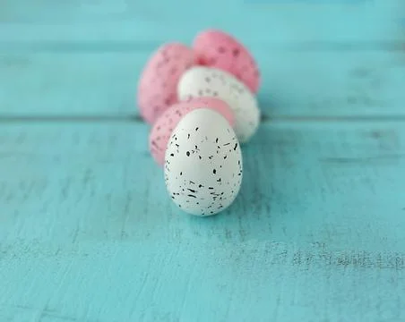 Bright easter eggs on a blue plain surface, easter decor Stock Photos