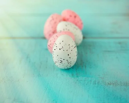 Bright easter eggs on a blue plain surface, easter decor Stock Photos