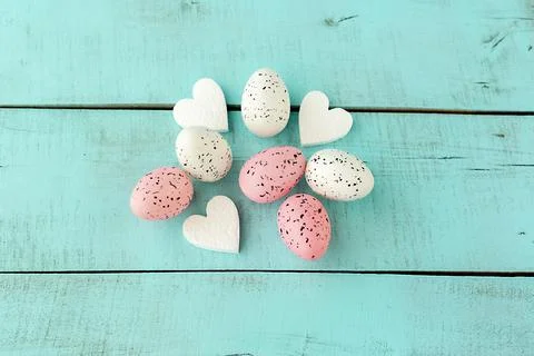 Bright easter eggs on a blue plain surface, easter decor Stock Photos
