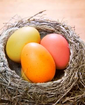Bright Easter eggs in a nest Stock Photos