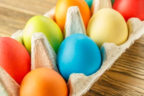 Bright Easter eggs in a special stand. Happy Easter. Close-up, blurred backgr Stock Photos