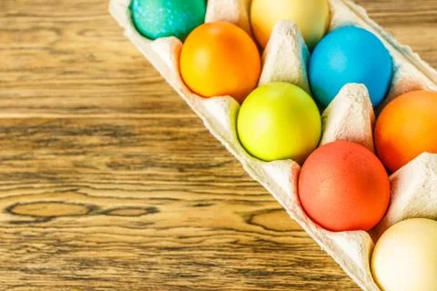 Bright Easter eggs in a special stand. Happy Easter. Close-up, blurred backgr Stock Photos