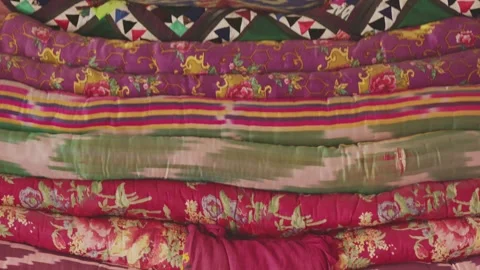 Bright Eastern blankets. Patchwork craftsmanship. Handicraft of Eastern cultures Stock Footage 262353728