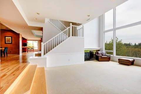 Bright empty house interior with large window Stock Photos