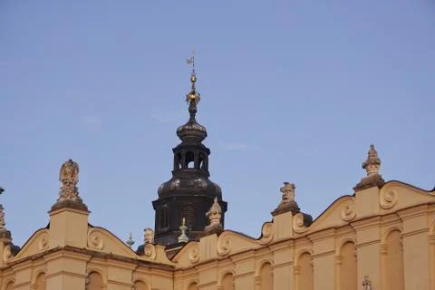 The bright facade of the building in the rays of the setting sun, the old tow Stock Photos