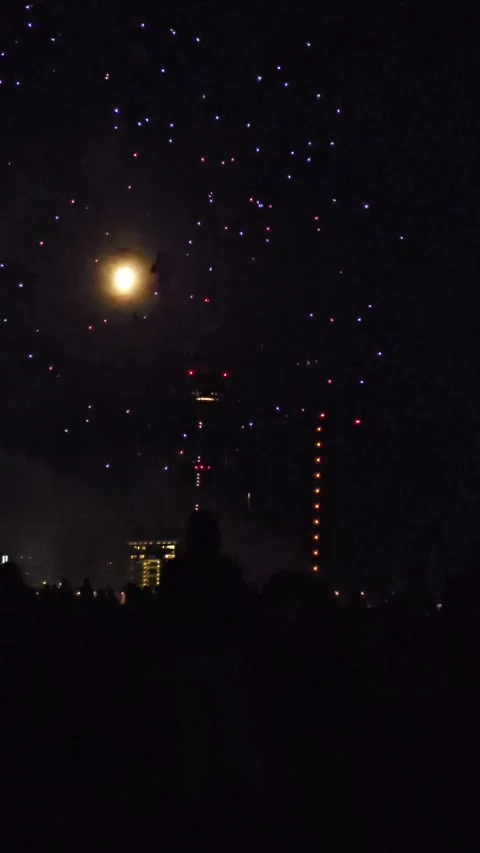 Bright Festive Fireworks and Multi-Colored Lights Near the Moon in the Nigh.. Stock Footage 341607734