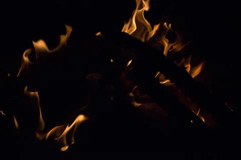Bright fire on a black background at night Stock Photos