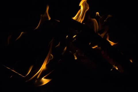 Bright fire on a black background at night Stock Photos
