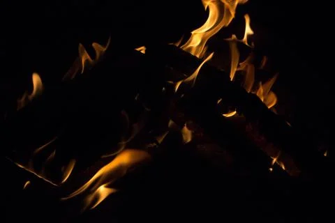 Bright fire on a black background at night Stock Photos