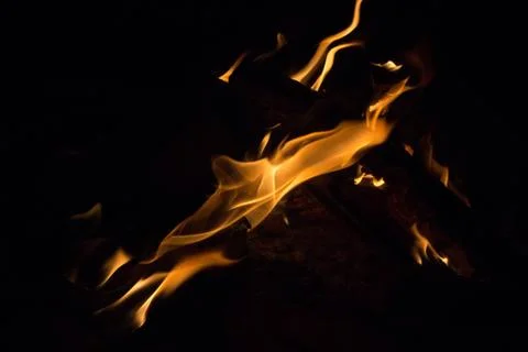 Bright fire on a black background at night Stock Photos