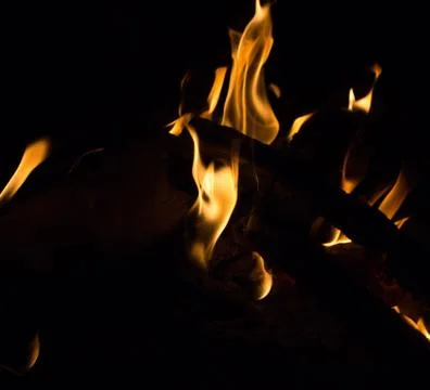 Bright fire on a black background at night Stock Photos