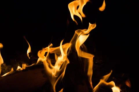Bright fire on a black background at night Stock Photos