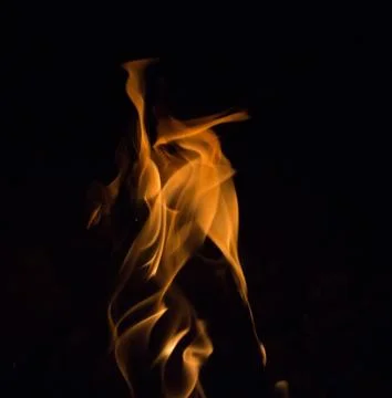 Bright fire on a black background at night Stock Photos