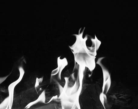 Bright fire on a black background at night Stock Photos