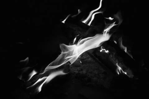 Bright fire on a black background at night Stock Photos