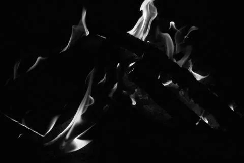 Bright fire on a black background at night Stock Photos