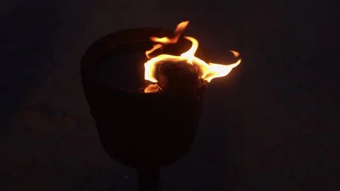 Bright fire burning in an oily stone fire in the night. Stock Footage 313439385