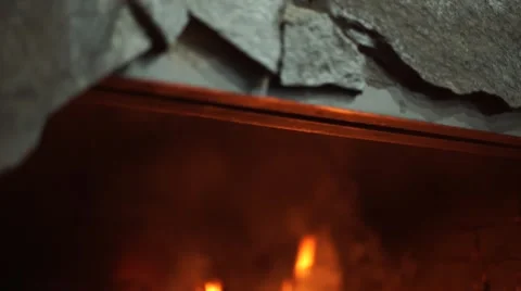 A bright fire in the fireplace. A warm light. A fireplace in a dark room. Beauti Stock Footage 64816007