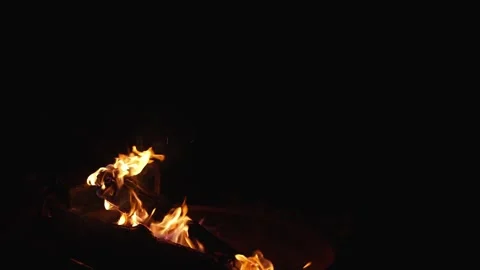 Bright fire flame against black  background shot in slow motion Stock Footage 335072148