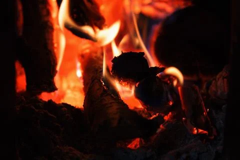 A bright fire of high temperature from natural firewood and branches burns .. Stock Photos