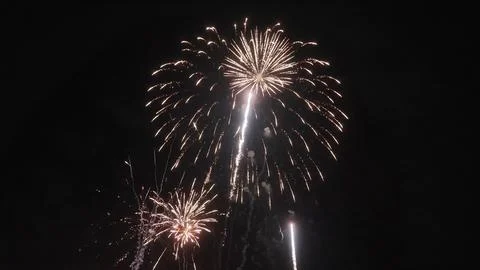 Bright firework display exploding in night sky Фото