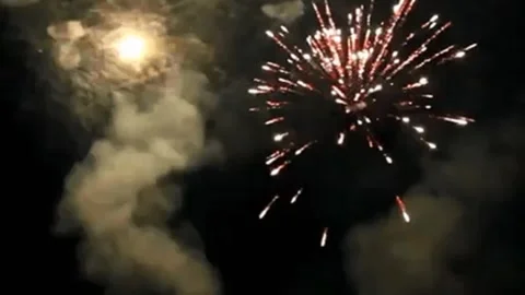Bright Fireworks Bursting in Midnight Sky for New Year Festival Stock Footage 344763490