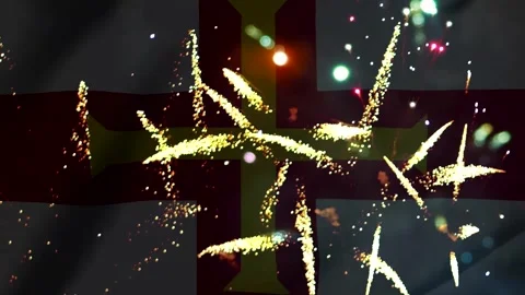 Bright fireworks display exploding over the waving flag of Guernsey island Vídeos de archivo 343690562