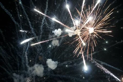 Bright Fireworks Display Over Dark Night Sky Fotos Stock