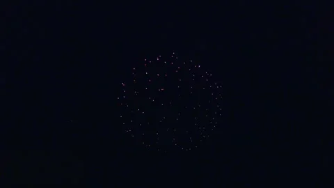 Bright fireworks explode with colorful sparks in the dark night sky, Ternitz, 動画素材 337854917