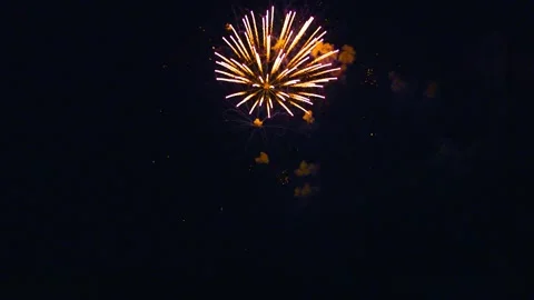 Bright fireworks explode with colorful sparks in the dark night sky, Ternitz, 動画素材 337855614