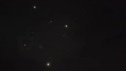 Bright Fireworks Exploding and Sparkling in Night Sky Stock Footage 340373451