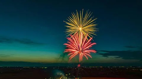 Bright Fireworks Exploding In The Night Sky With Vibrant Red And Yellow Co... 库存照片