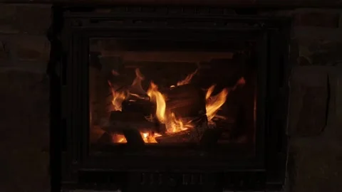Bright flame burning on fireplace in chimney of country cottage 動画素材 175477963