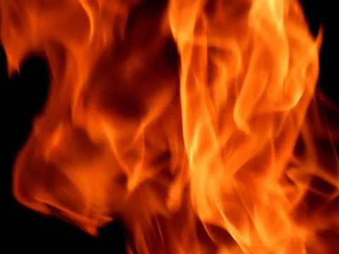 Bright flame of fire on a black background Stock Photos