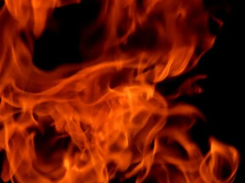 Bright flame of fire on a black background Stock Photos