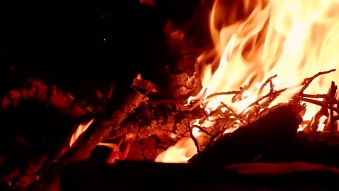 The bright flame of the fire burns in na... | Stock Video | Pond5