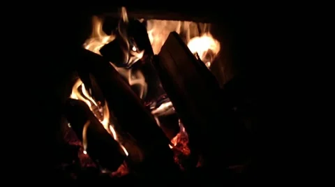 Bright flame fire in the fireplace at night in winter for warmth in the house Stock Footage 168217258