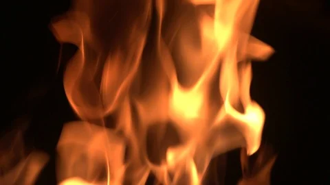 Bright flame in a fireplase on a black background Stock Footage 120942637