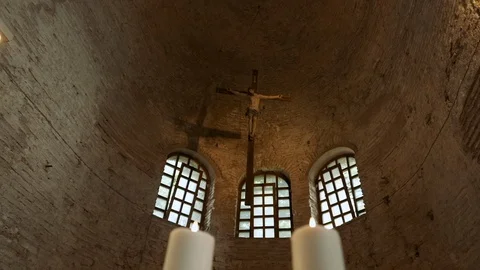 Bright Flame Of Two Great Candles. An Ancient Temple With The Crucifixion Of Vídeos de archivo 111145877